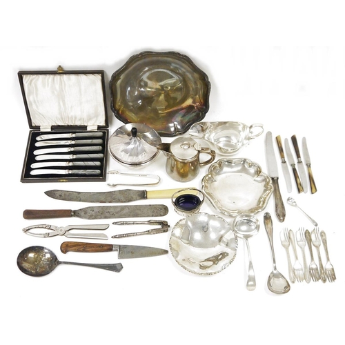 311 - Cased set of silver plated butter knives and an assortment of other flatware, dishes, nutcracker, et... 