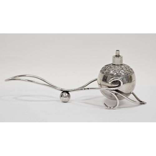 326 - South East Asian white metal table lighter on a silver stand, the globe-shape burner with presentati... 