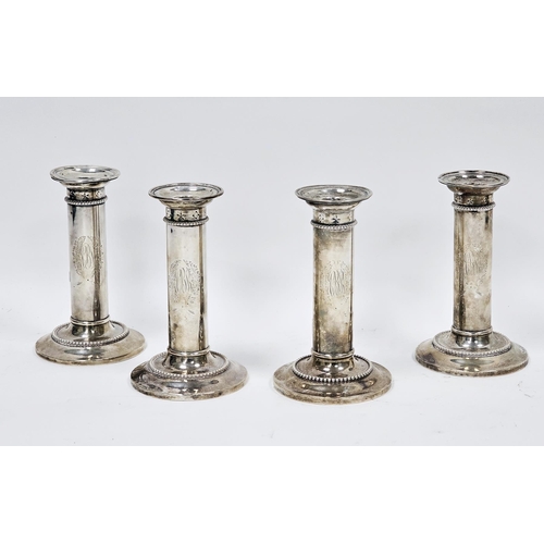 331 - Set of four white metal column candlesticks, all stamped sterling to base and B.B & B Co and number ... 