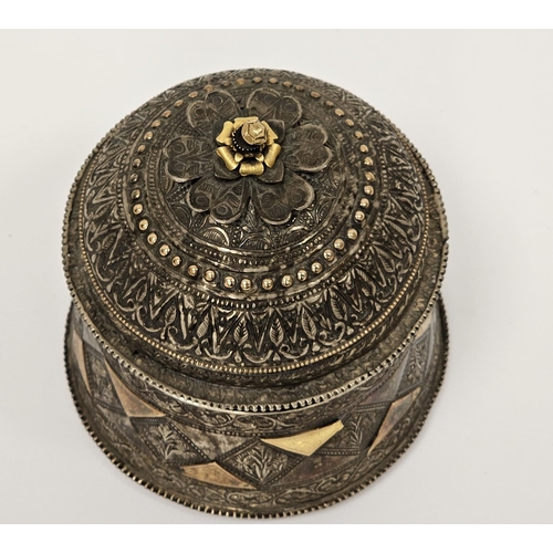 333 - Indian white metal caddy or box, of cylindrical form with profuse intricate repousse decoration, the... 