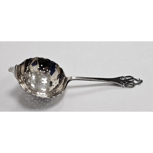 345A - George V silver tea strainer, Sheffield 1931, Roberts & Dove, with ornate pierced handle and scallop... 