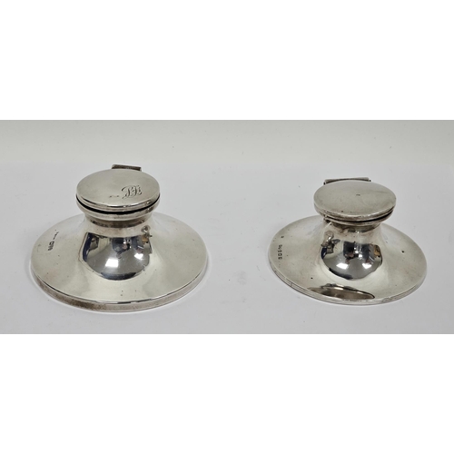 355 - Two early 20th century silver capstan inkwells, the first hallmarked Chester, 1924, the hinged top e... 