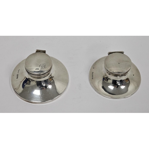 355 - Two early 20th century silver capstan inkwells, the first hallmarked Chester, 1924, the hinged top e... 