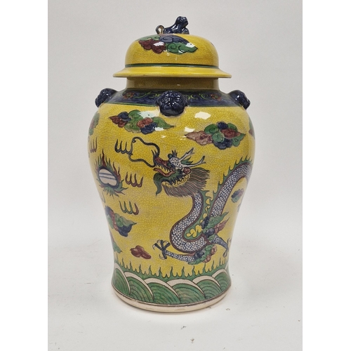 36 - Contemporary Chinese-style baluster yellow ground jar and cover, decorated with a scrolling dragon c... 