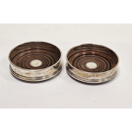 362 - LOT WITHDRAWN
Pair of silver bottle coasters with turned wooden bases, London 1998 David R Mills, wi... 