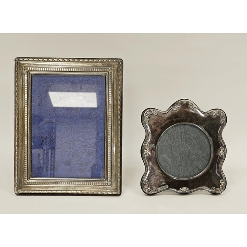 373 - Two silver photograph frames, the first rectangular with an easel back, Sheffield 1989 R Carr, 23cm ... 