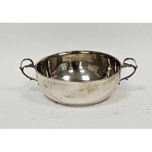 393 - Silver porringer, London 1949, maker CB, of plain form with foliate scroll handles, 16cm wide x 6cm ... 