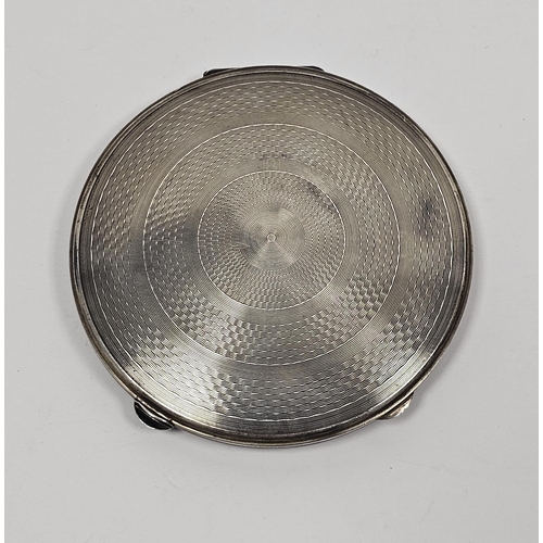 396 - Silver circular compact, London 1948, D Shackman & Sons, the case with engine-turned concentric deco... 