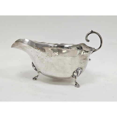 431 - George V Silver Sauce Boat, Reid & Sons, Birmingham 1930, the plain body with scalloped rim, scrolli... 