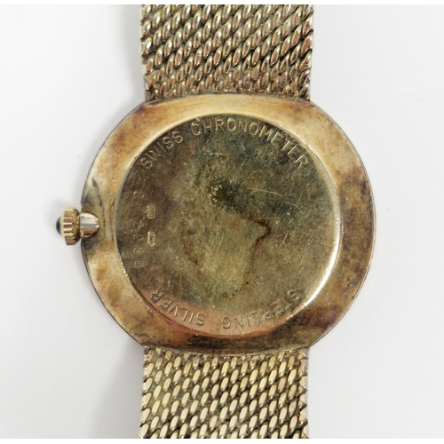 455 - Silver gilt Dunhill wristwatch, with stylised Arabic hour markers, cabochon blue stone mounted windi... 