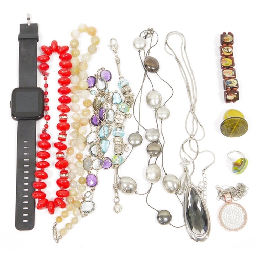 527 - Assorted costume jewellery to include necklaces, a Pandora-style charm bracelet, a Smart watch, a bi... 