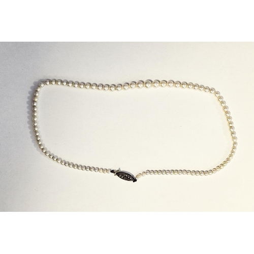 560 - String of graduated cultured pearls with silver and marcasite set clasp