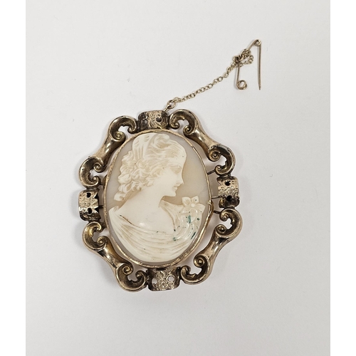 590 - Cameo brooch carved with head and shoulders of young girl, within engraved and scroll gold-coloured ... 