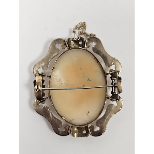 590 - Cameo brooch carved with head and shoulders of young girl, within engraved and scroll gold-coloured ... 