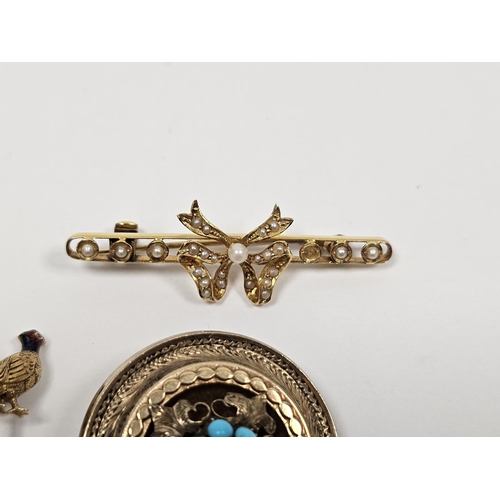 629 - 15ct gold seed pearl set bow brooch (one pearl lacking), stamped 15CT, a yellow metal and enamelled ... 