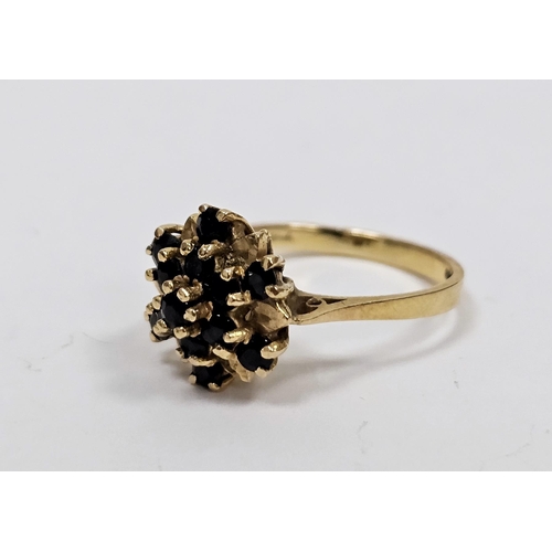 639 - 18ct gold and blue stone dress ring (flowerhead design) possibly sapphires size N