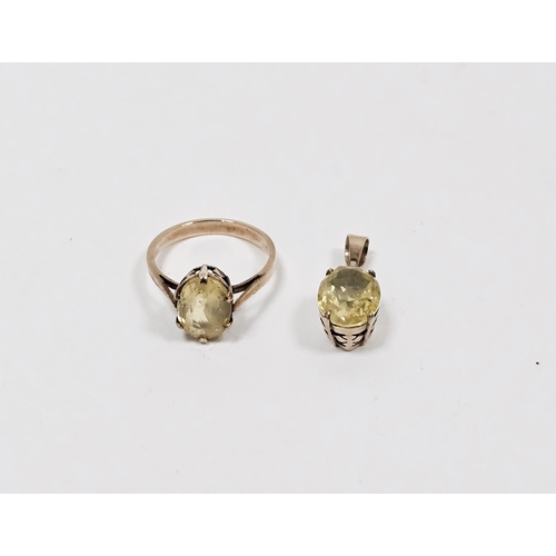 641 - Gold coloured metal and yellow stone dress ring set oval stone (possibly citrine) size K 1/2 and gol... 