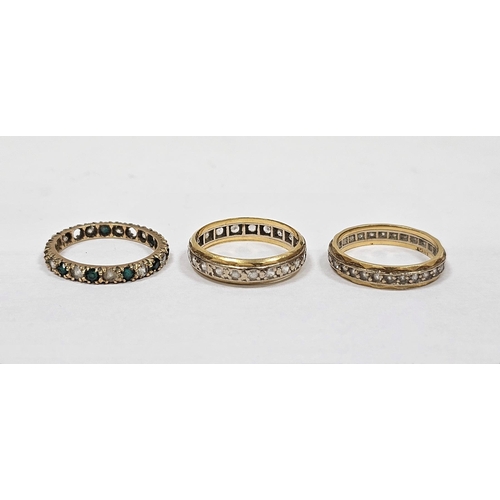 651 - 18ct gold and white stone eternity ring and two gold coloured metal further eternity rings, some wit... 