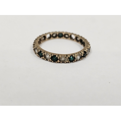 651 - 18ct gold and white stone eternity ring and two gold coloured metal further eternity rings, some wit... 