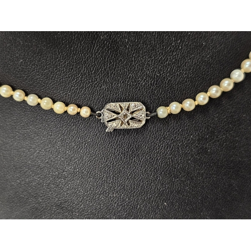 662 - Single strand cultured pearl choker, graduated, the 9ct white gold clasp set numerous tiny diamonds.... 