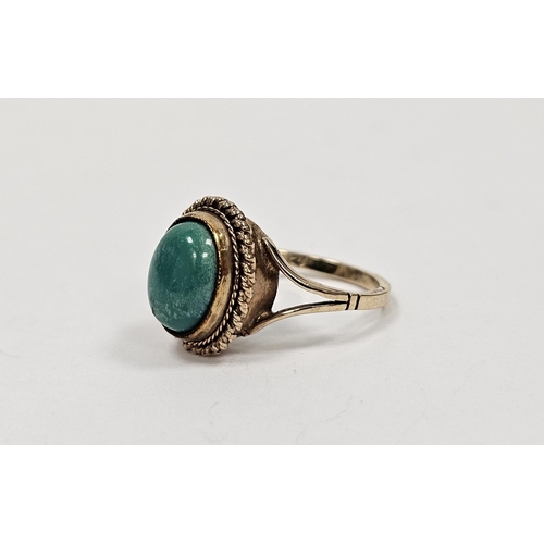 664 - 9ct gold and turquoise cabochon ring set single oval stone with rope twist surround. Ring size I, ap... 