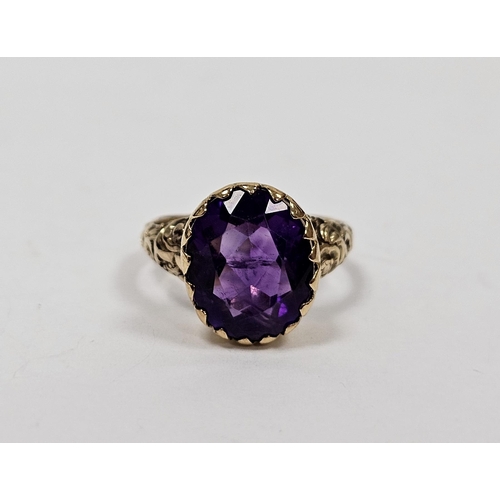 666 - Gold coloured metal and amethyst coloured stone ring set oval facet cut stone in collet setting, eng... 