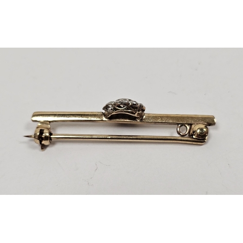 669 - Gold and diamond cluster bar brooch, the centre stone approx 1/3ct and having surround of nine small... 