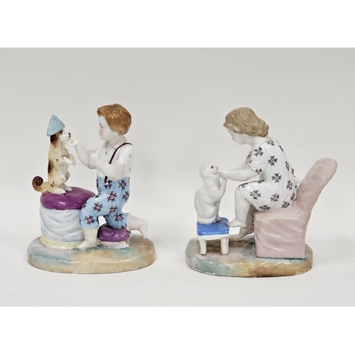 67 - Two continental porcelain figure groups, one of a boy kneeling in front of a stool feeding a dog wea... 