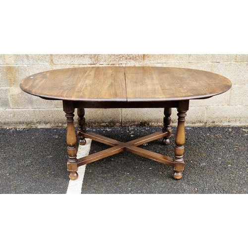 1197 - Ercol dining room suite comprising a dark stained elm top extending oval dining table, 163cm long (c... 