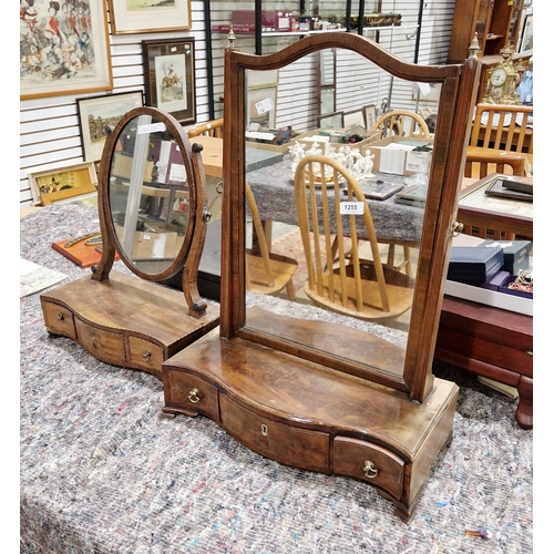 1255 - 19th century walnut swing mirror, 61cm high together with an Edwardian mahogany oval swing mirror (2... 