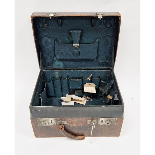 130 - Late 19th/early 20th century leather travelling dressing case, the hinged lid opening to a green fab... 