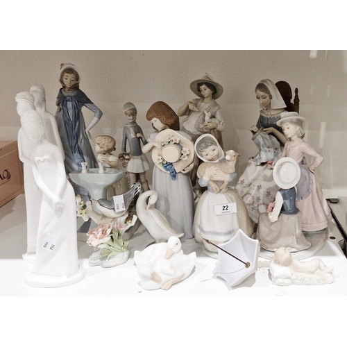 22 - Lladro porcelain figure of a seated seamstress, Lladro porcelain figure of a young shepherd feeding ... 