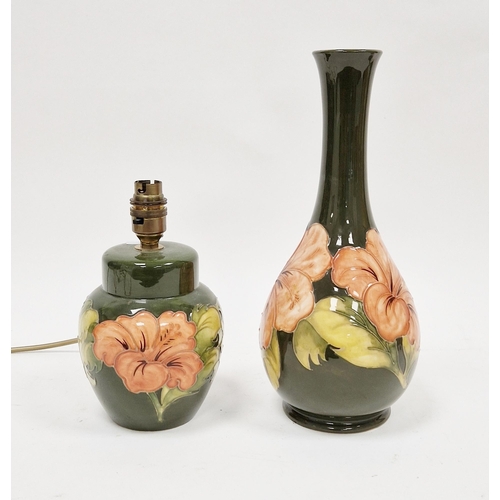 32 - Moorcroft pottery vase, baluster-shaped, green ground and with Coral Hibiscus tubelined decoration, ... 