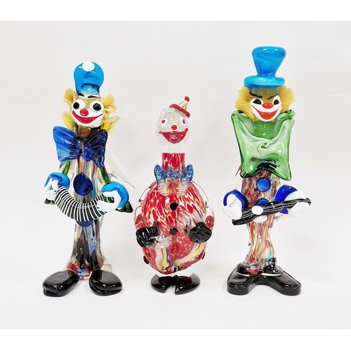 42 - Three Murano glass figures of clowns, including an example playing an accordion and another with a g... 