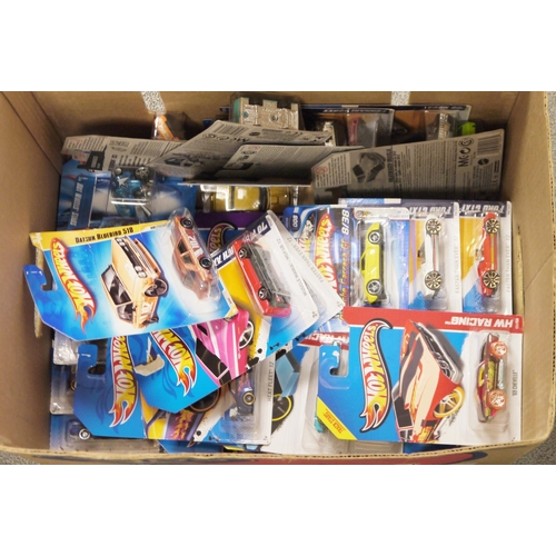 422 - Large quantity of Hot Wheels die-cast vehicles, boxed, including: HW Showroom models, an Angry Birds... 