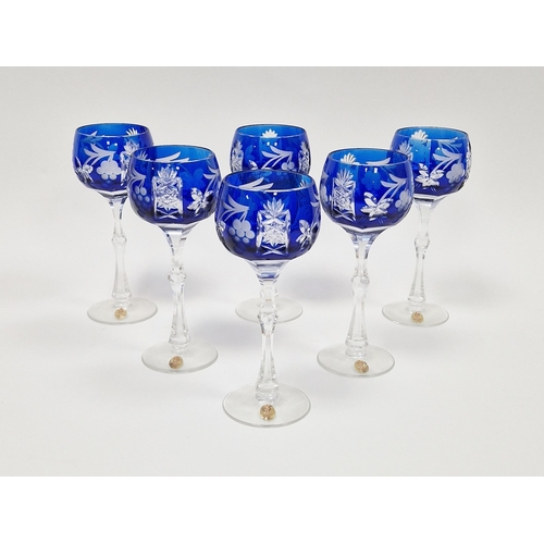 46 - Six contemporary German blue-flashed, cut and etched wine-glasses, each cut with fruiting vine and s... 