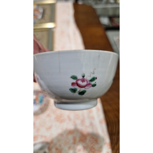 83 - Pair Chinese porcelain tea bowls and three matching saucers, all painted with famille rose colours w... 