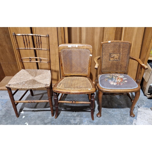 1039 - Three chairs including an early 20th century walnut bedroom elbow chair, the bergère back with centr... 