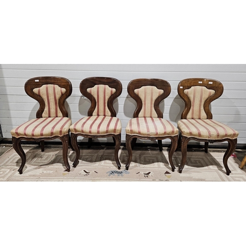 1040 - Set of four Victorian rosewood dining chairs, the shaped back with upholstered padded panels and stu... 