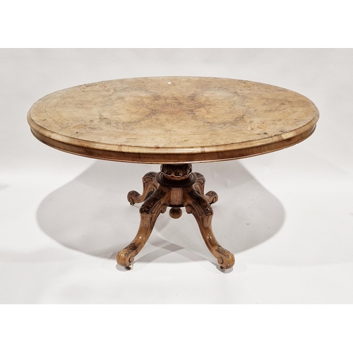 1080 - Victorian walnut inlaid tilt-top loo table, the oval top raised on a carved baluster support and fou... 