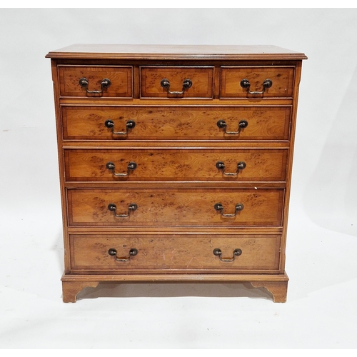 1121 - Yew wood chest of three short drawers over four graduating long drawers with metal swan neck handles... 