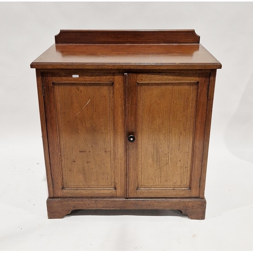 1122 - Edwardian mahogany cupboard with ebony and boxwood string inlay, the top with upstand, over two pane... 