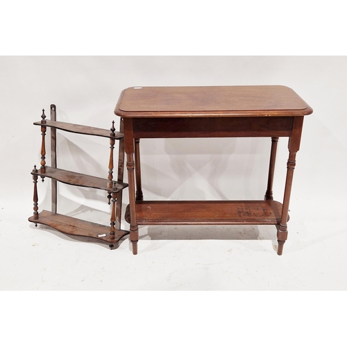 1136 - Mahogany waterfall hanging shelf, the three shaped shelves joined by turned spindle supports, 53cm w... 