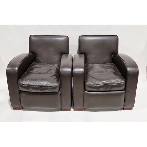 1167 - Pair of brown leather armchairs in the Art Deco style, raised on wooden square supports, 80cm wide x... 