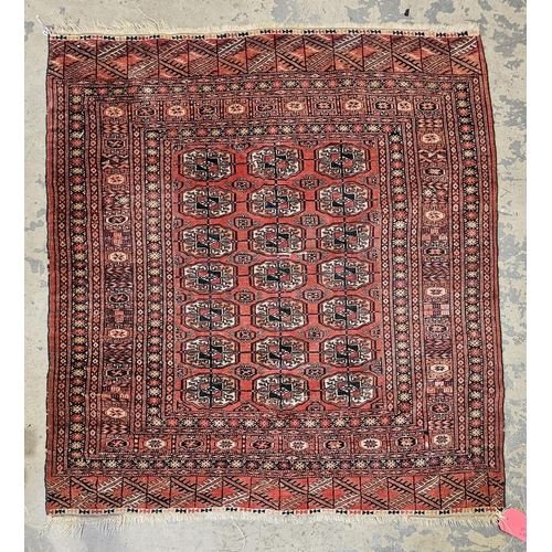 1265 - Eastern red ground rug with three rows of seven elephant foot guls, multiple geometric borders 123cm... 