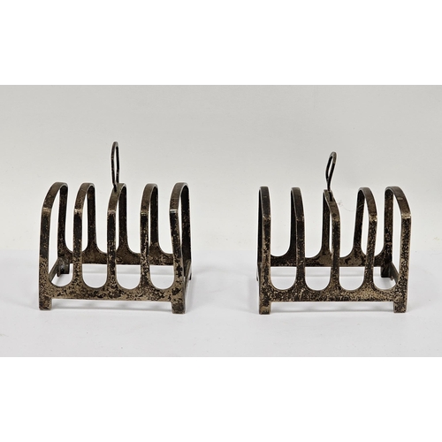 276A - Pair of small silver toast racks, Sheffield 1938 and 1941, Walker & Hall, each with four plain secti... 