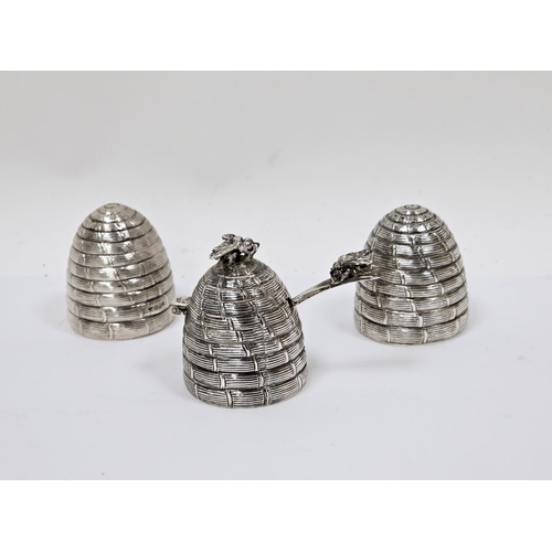 299 - Novelty silver condiment set in the form of beehives, London 1990, Garrard & Co Ltd, comprising salt... 