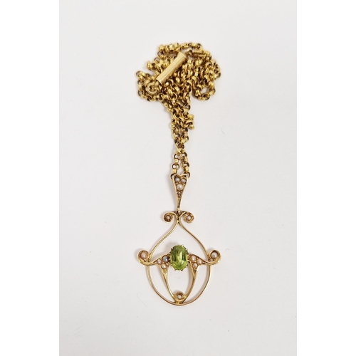 372 - Edwardian 15ct gold, peridot and seedpearl pendant, scroll design with oval peridot, on gold-plated ... 