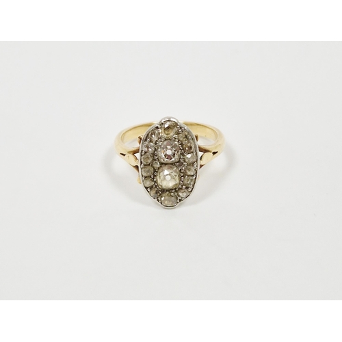 464 - 18ct gold and diamond dress ring, elliptical, set old cut stones, the two centre cushion-shaped each... 