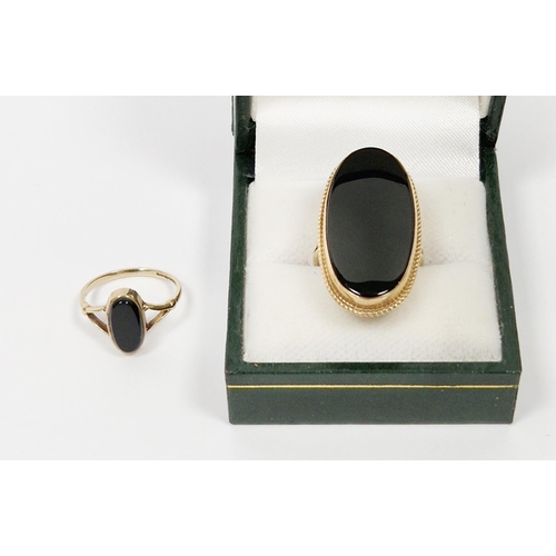 478 - 9ct gold and black onyx large oval ring (size O) and 9ct gold and onyx small oval ring (size J1/2) (... 